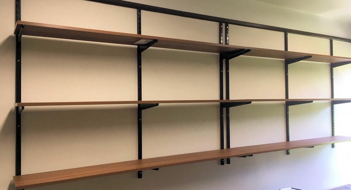 Installation of Dark Walnut Shelves at the China Centre, Jesus College in Cambridge.