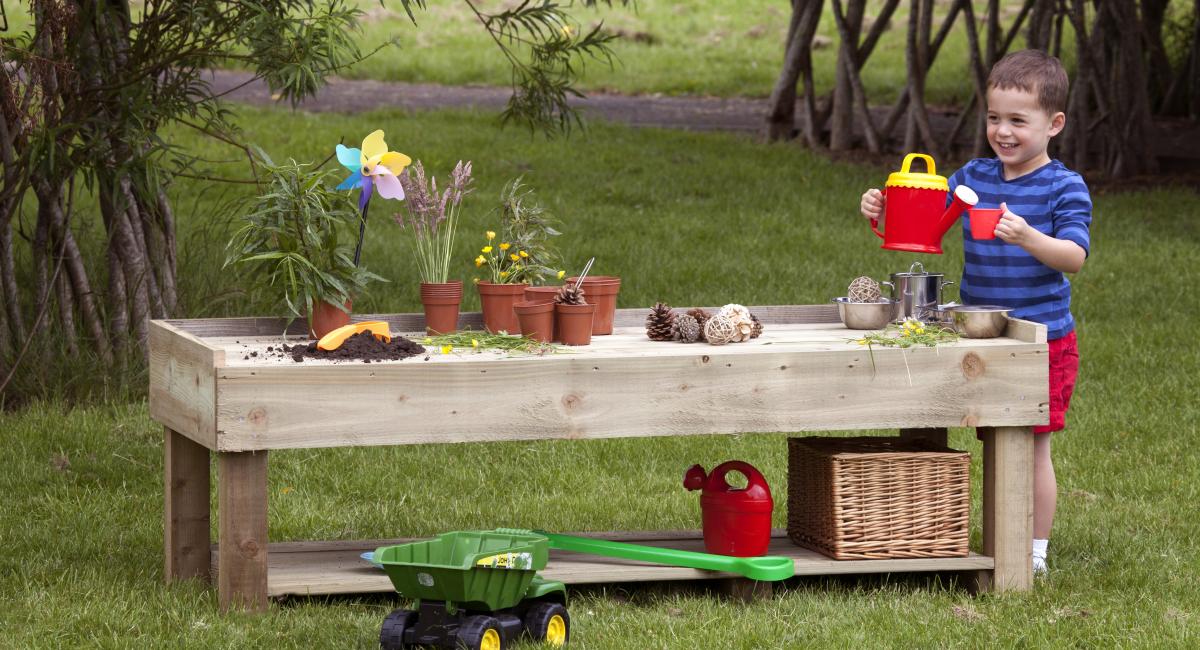 Inspirational Nurseries - Outdoor Busy Bench.  Wooden creative play bench.