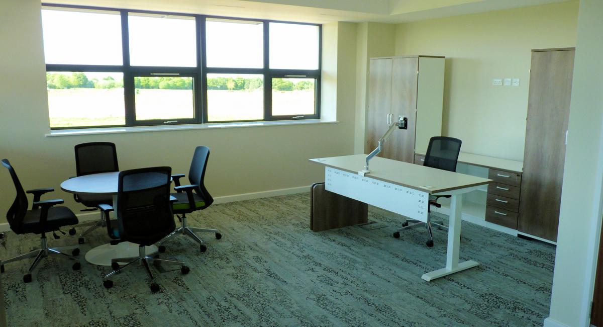 Cantilever office desk and black task chair.